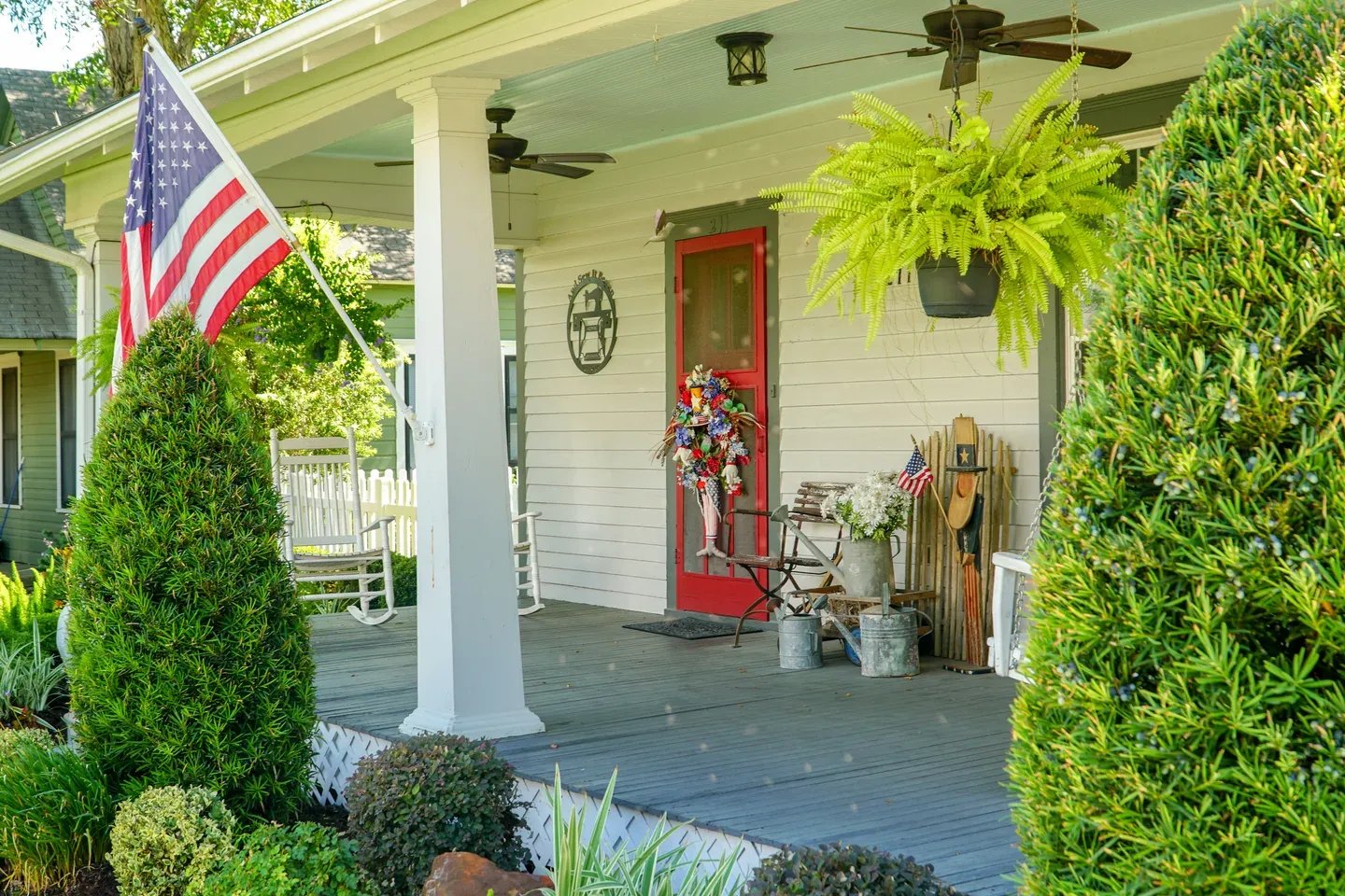 a porch with a flag on the front of it