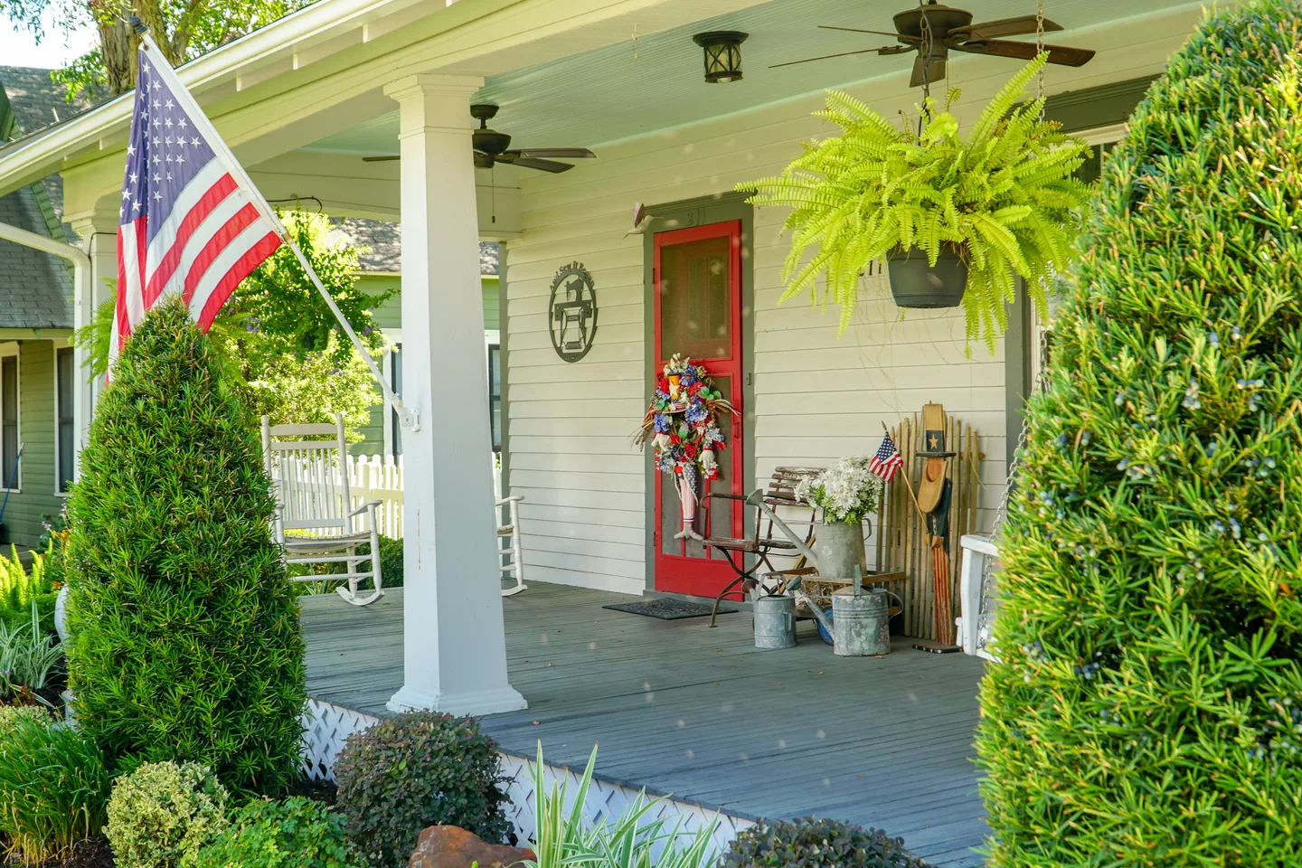 a porch with a flag on the front of it